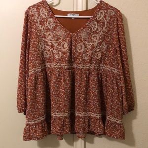Used burnt orange blouse with beige embroidered details.